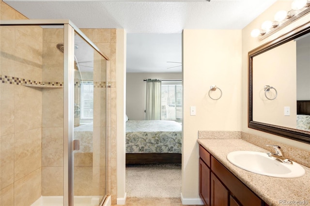 20389 E Powers Pl, Centennial, CO 80015 - ensuite bathroom with vanity, a stall shower, and a textured ceiling