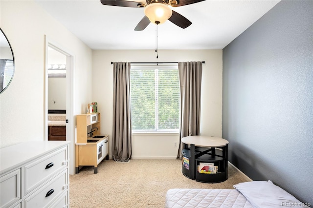 20389 E Powers Pl, Centennial, CO 80015 - bedroom with light carpet, ensuite bathroom, and a ceiling fan