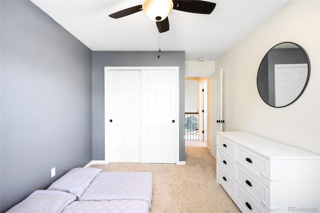 20389 E Powers Pl, Centennial, CO 80015 - bedroom with light carpet, a closet, and a ceiling fan