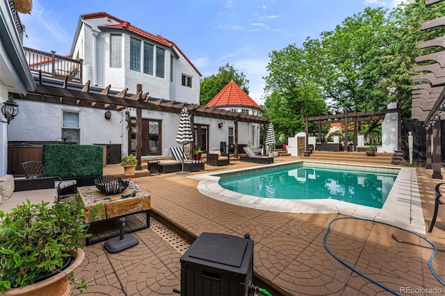 view of swimming pool with a pergola, an outdoor hangout area, french doors, and a patio area