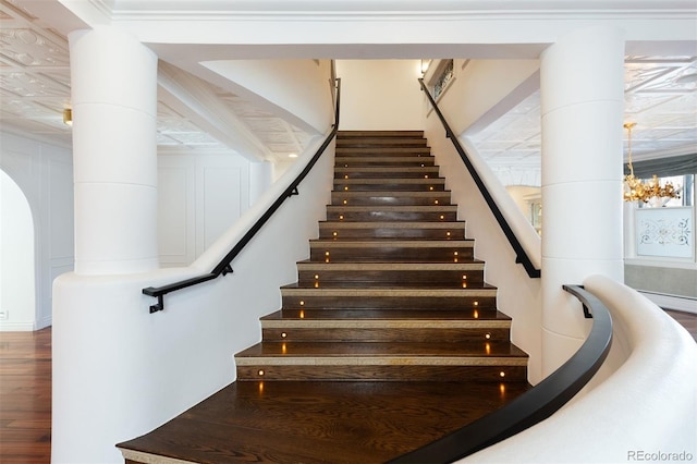 staircase with wood-type flooring