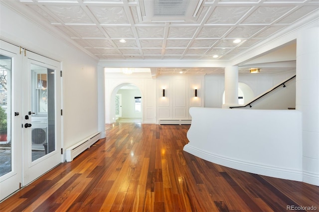 corridor featuring french doors, dark hardwood / wood-style floors, and baseboard heating