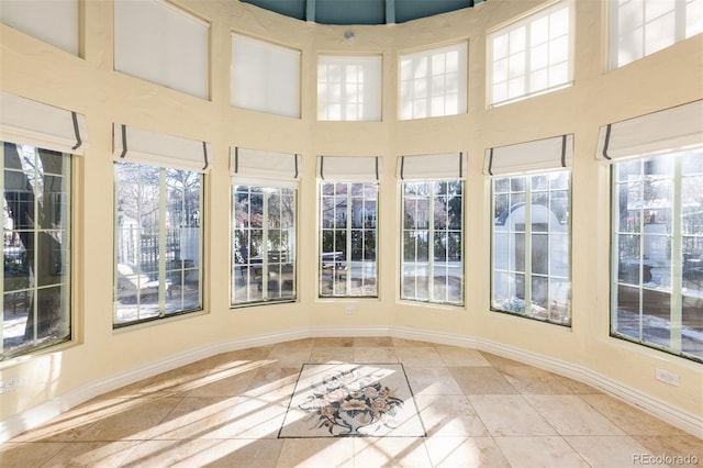 unfurnished sunroom featuring plenty of natural light