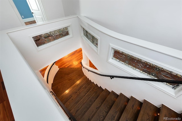 stairs with wood-type flooring