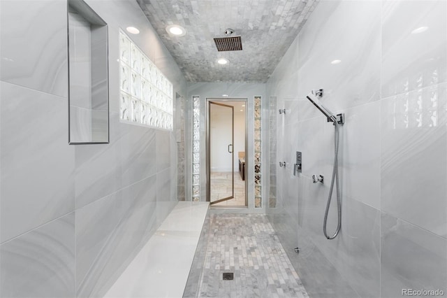 bathroom with tiled shower