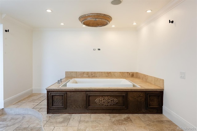 bathroom with a bath and ornamental molding