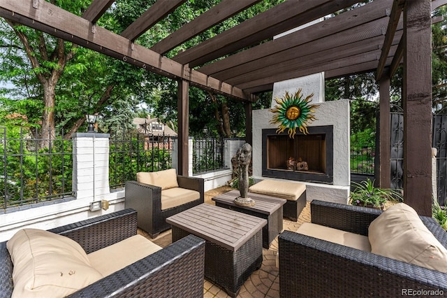 view of patio with an outdoor living space with a fireplace and a pergola