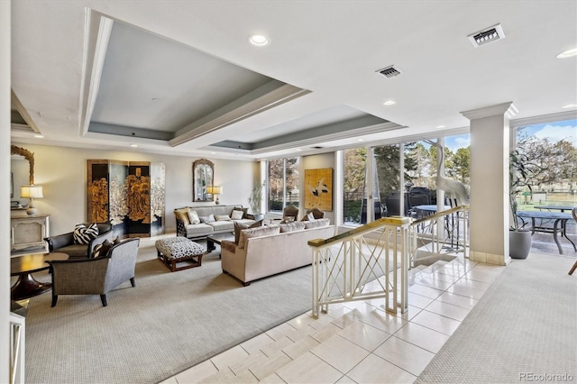 living room featuring a raised ceiling, recessed lighting, light tile patterned flooring, and visible vents