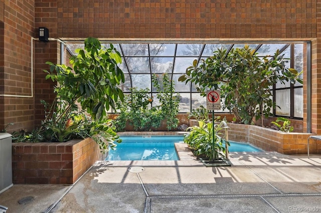 outdoor pool featuring a patio area