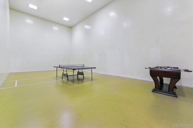 game room with finished concrete floors