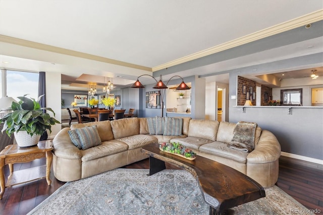 1900 E Girard Pl Unit 907, Englewood, CO 80113 - living area featuring hardwood / wood-style flooring, baseboards, a chandelier, and crown molding
