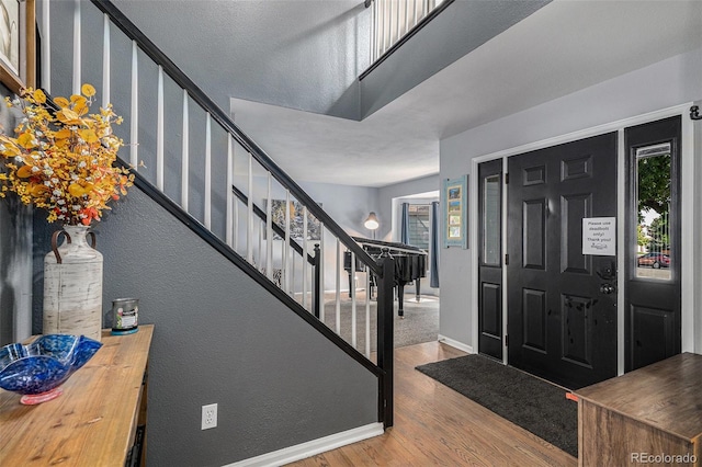 9924 Silver Maple Way, Highlands Ranch, CO 80129 - entrance foyer featuring wood finished floors, stairway, and plenty of natural light