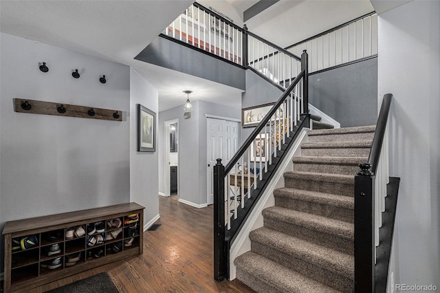 9924 Silver Maple Way, Highlands Ranch, CO 80129 - stairway with wood finished floors and a towering ceiling