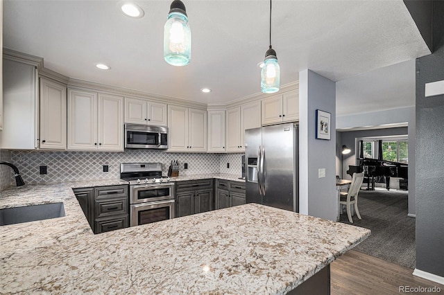 9924 Silver Maple Way, Highlands Ranch, CO 80129 - kitchen with stainless steel appliances, decorative backsplash, dark wood-type flooring, gray cabinetry, and recessed lighting