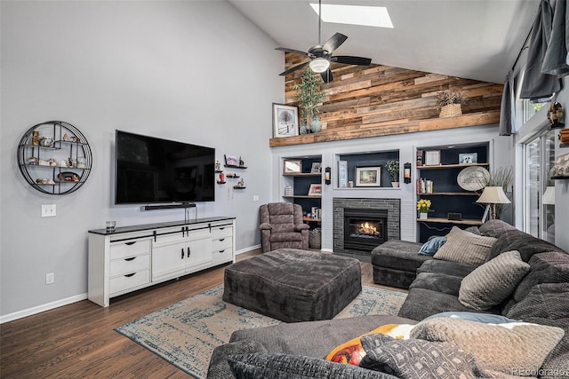 9924 Silver Maple Way, Highlands Ranch, CO 80129 - living room with a brick fireplace, a skylight, high vaulted ceiling, dark wood-type flooring, and a ceiling fan