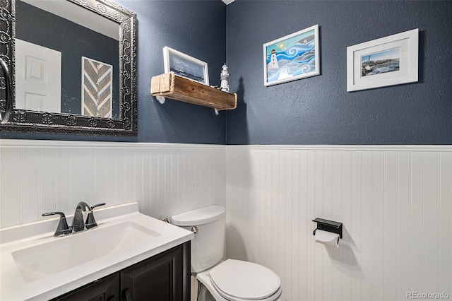 9924 Silver Maple Way, Highlands Ranch, CO 80129 - bathroom featuring wainscoting and vanity