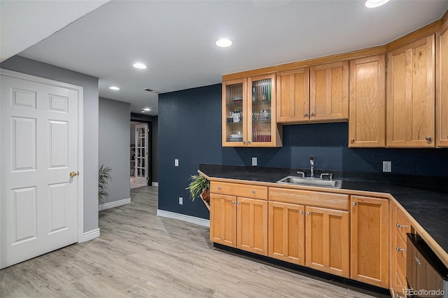 9924 Silver Maple Way, Highlands Ranch, CO 80129 - kitchen featuring dark countertops, recessed lighting, light wood-style floors, glass insert cabinets, and dishwasher