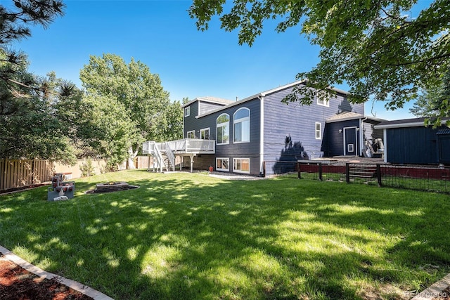 9924 Silver Maple Way, Highlands Ranch, CO 80129 - fenced backyard with stairs, an outdoor fire pit, and a deck