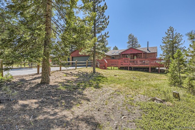 view of yard featuring a wooden deck