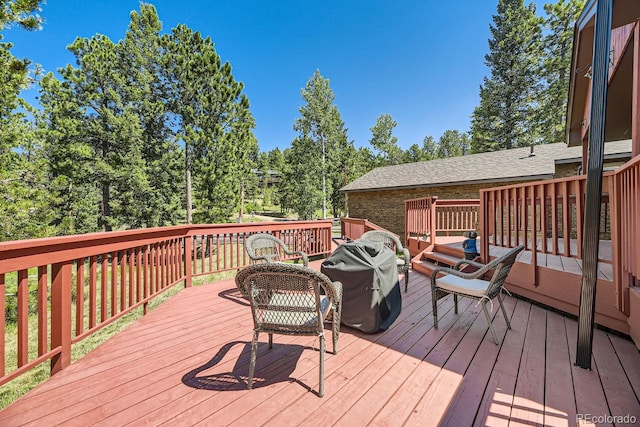 wooden deck with grilling area