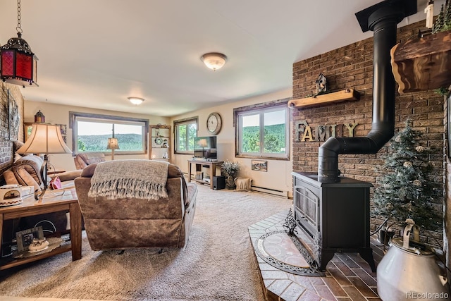 carpeted living room with a baseboard radiator and a wood stove