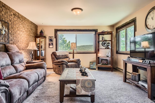 carpeted living room with brick wall