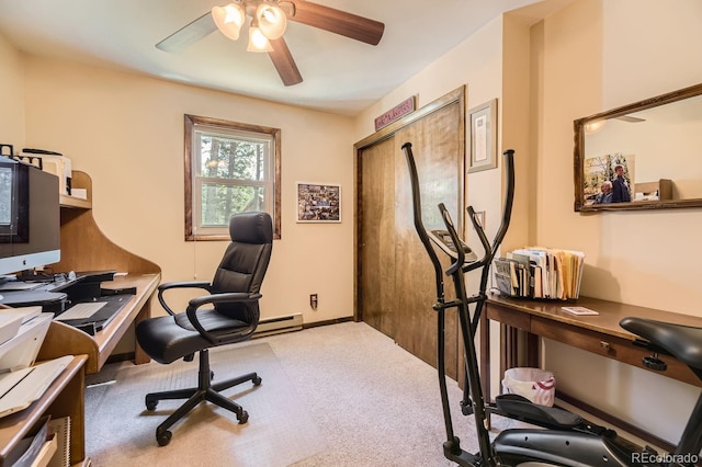 carpeted home office featuring ceiling fan