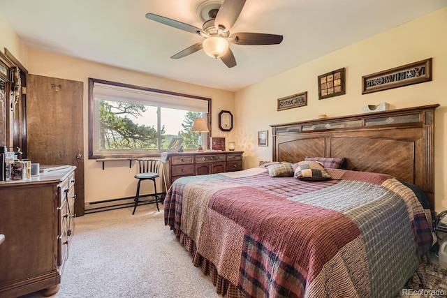 carpeted bedroom with a baseboard heating unit and ceiling fan