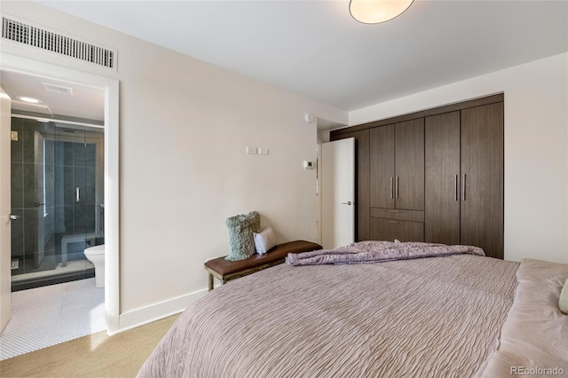 1020 15th St Unit 42A, Denver, CO 80202 - bedroom with a closet, baseboards, and ensuite bathroom