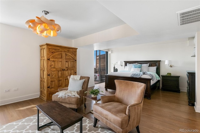 1020 15th St Unit 42A, Denver, CO 80202 - bedroom featuring wood finished floors and baseboards