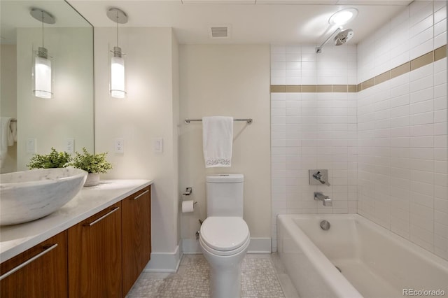 1020 15th St Unit 42A, Denver, CO 80202 - full bathroom featuring vanity, toilet, tile patterned floors, shower / bath combination, and baseboards