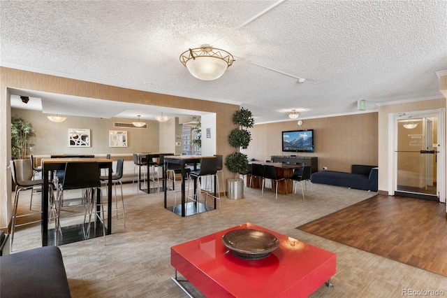 1020 15th St Unit 42A, Denver, CO 80202 - living room with ornamental molding, wood finished floors, and a textured ceiling