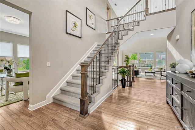 11821 Discovery Ln, Parker, CO 80138 - staircase featuring wood-type flooring, plenty of natural light, and a high ceiling