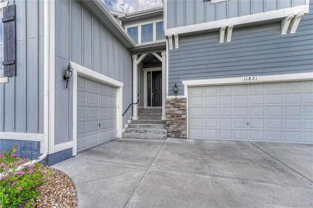 11821 Discovery Ln, Parker, CO 80138 - entrance to property with driveway, board and batten siding, a garage, and stone siding