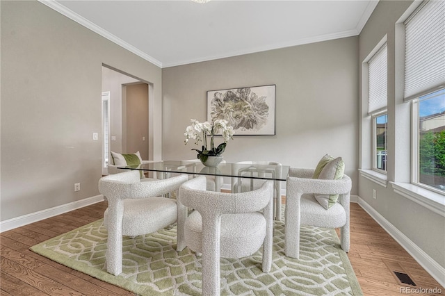 11821 Discovery Ln, Parker, CO 80138 - dining space featuring wood finished floors and ornamental molding