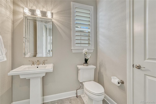 11821 Discovery Ln, Parker, CO 80138 - bathroom featuring baseboards and toilet