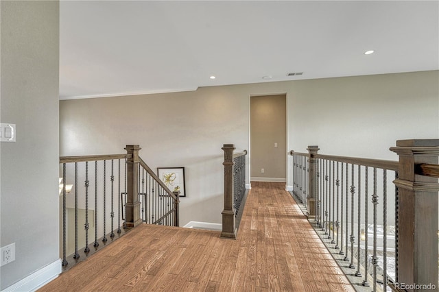 11821 Discovery Ln, Parker, CO 80138 - corridor with wood finished floors, an upstairs landing, and recessed lighting