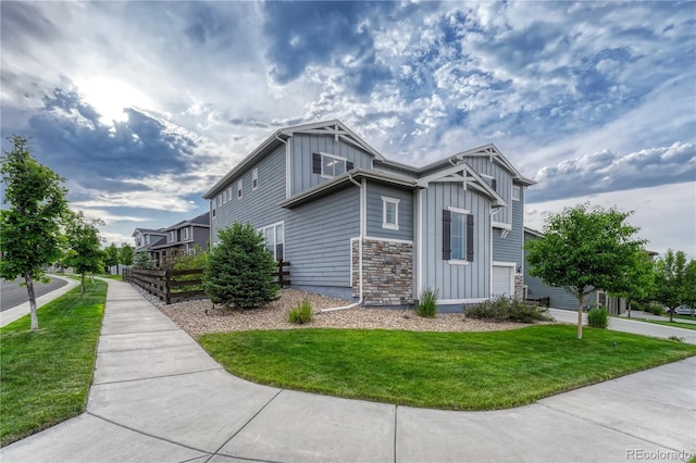 11821 Discovery Ln, Parker, CO 80138 - view of side of property with board and batten siding, a yard, and an attached garage