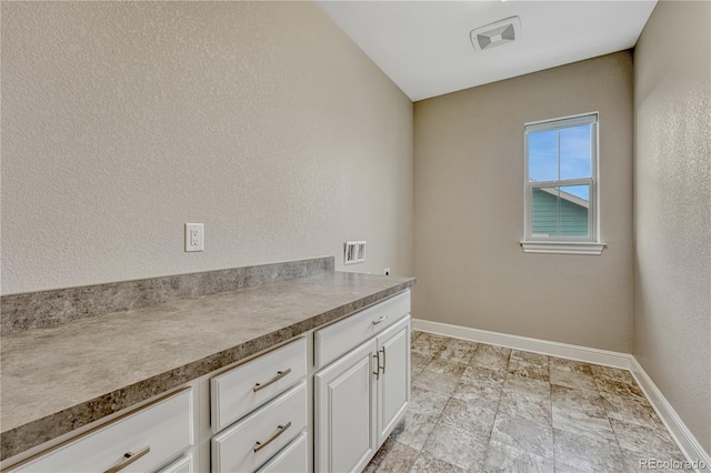 11821 Discovery Ln, Parker, CO 80138 - laundry area with hookup for a washing machine and cabinet space