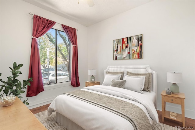 bedroom featuring hardwood / wood-style floors and ceiling fan