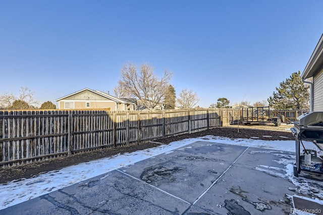 snow covered patio with a playground