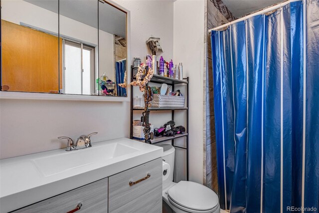 15628 E Girard Pl, Aurora, CO 80013 - full bath with a shower with curtain, toilet, and vanity