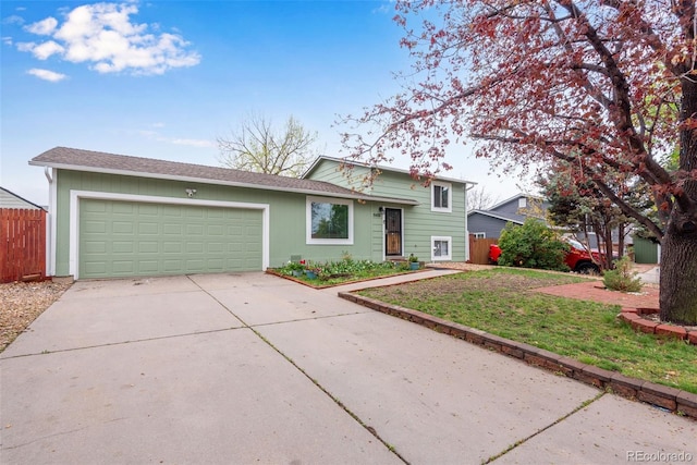 15628 E Girard Pl, Aurora, CO 80013 - tri-level home with a garage and driveway