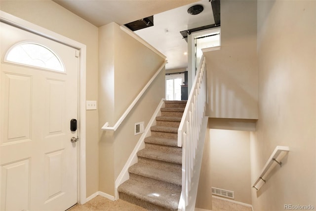 view of carpeted entrance foyer