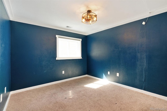 spare room featuring crown molding