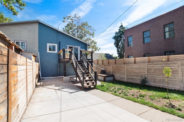 rear view of property featuring a patio area