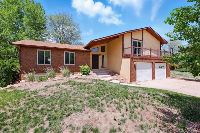 4150 Gleneagle Ct, Colorado Springs, CO 80909 - view of front of property featuring stucco siding, concrete driveway, an attached garage, a balcony, and brick siding