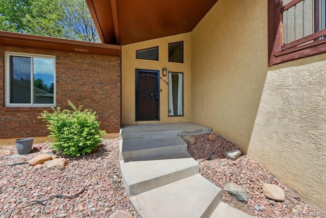 4150 Gleneagle Ct, Colorado Springs, CO 80909 - property entrance featuring stucco siding and brick siding