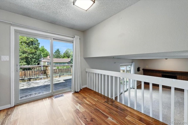 4150 Gleneagle Ct, Colorado Springs, CO 80909 - empty room featuring a textured ceiling, wood finished floors, and baseboards