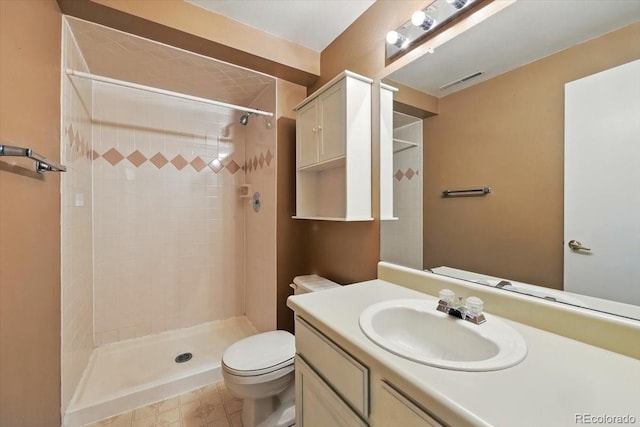 4150 Gleneagle Ct, Colorado Springs, CO 80909 - bathroom with toilet, vanity, and tiled shower